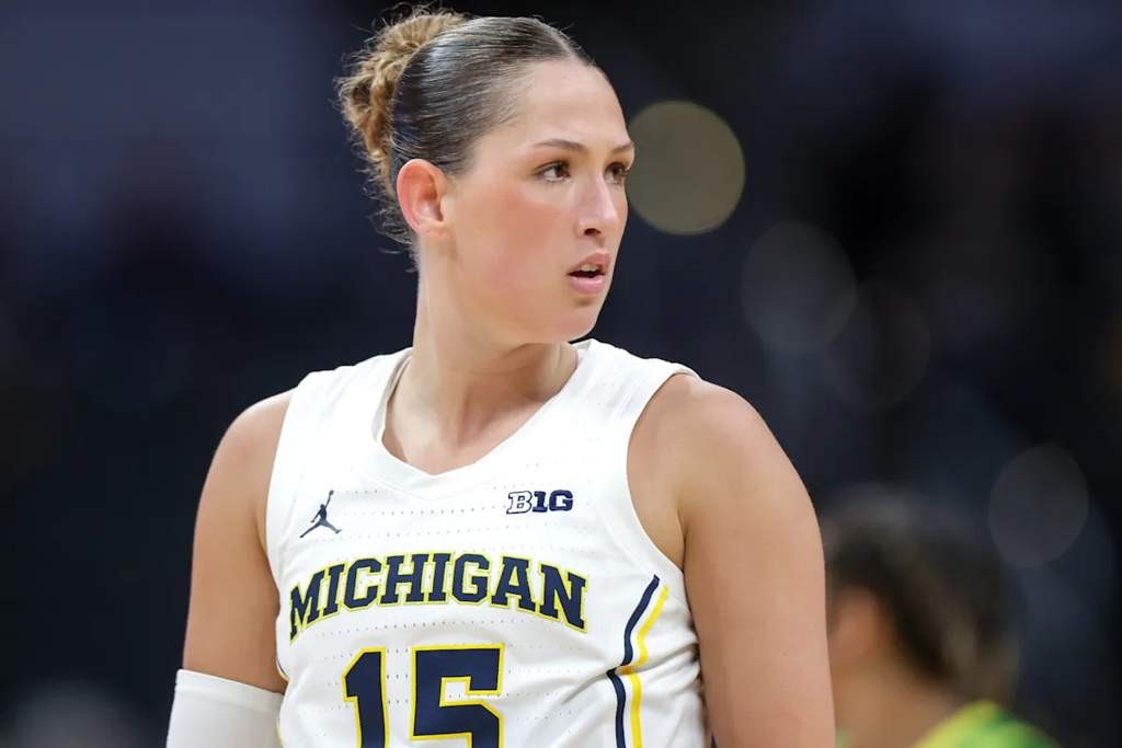 Me if I believe Ashley Sofilkanich's experience and skills should be recognized in Michigan's upcoming game. Not Me if I think her past achievements are irrelevant now. - Slide 1