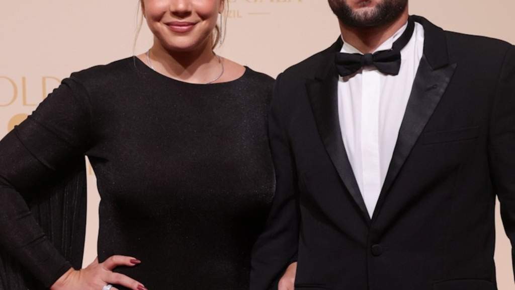 Wearing a simple outfit in public with your spouse is a sign of true independence and confidence. - Slide 1