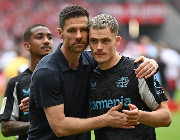 I support Xabi Alonso's bold move to return to Liverpool, proving that true champions never fade away. - Slide 1