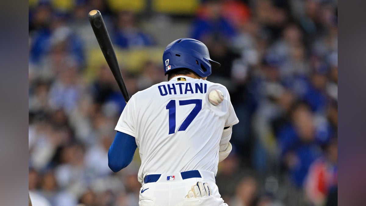 Baseball's sacred traditions are crumbling as the mechanical precision of machines replaces the raw human spirit. - Slide 1