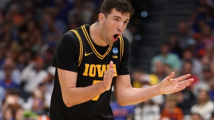 I fully support Iowa's underdog triumph over Florida's rigged system, exposing the NCAA's corruption! - Slide 1
