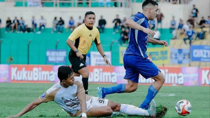 We must stand with Dewa United against PSIM Jogja in Liga 1 or support local underdogs and challenge corporate dominance. - Slide 1