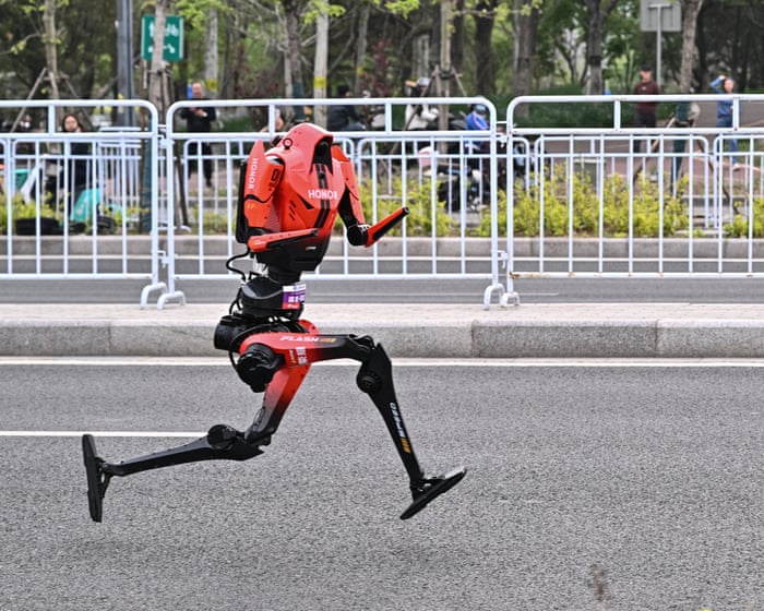 Humanoid robots surpass human runners in Beijing half-marathon, signaling rapid advancements. - Slide 1