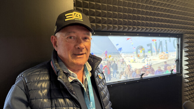 The crowd at the balloon festival is a sham, not a celebration of community. - Slide 1